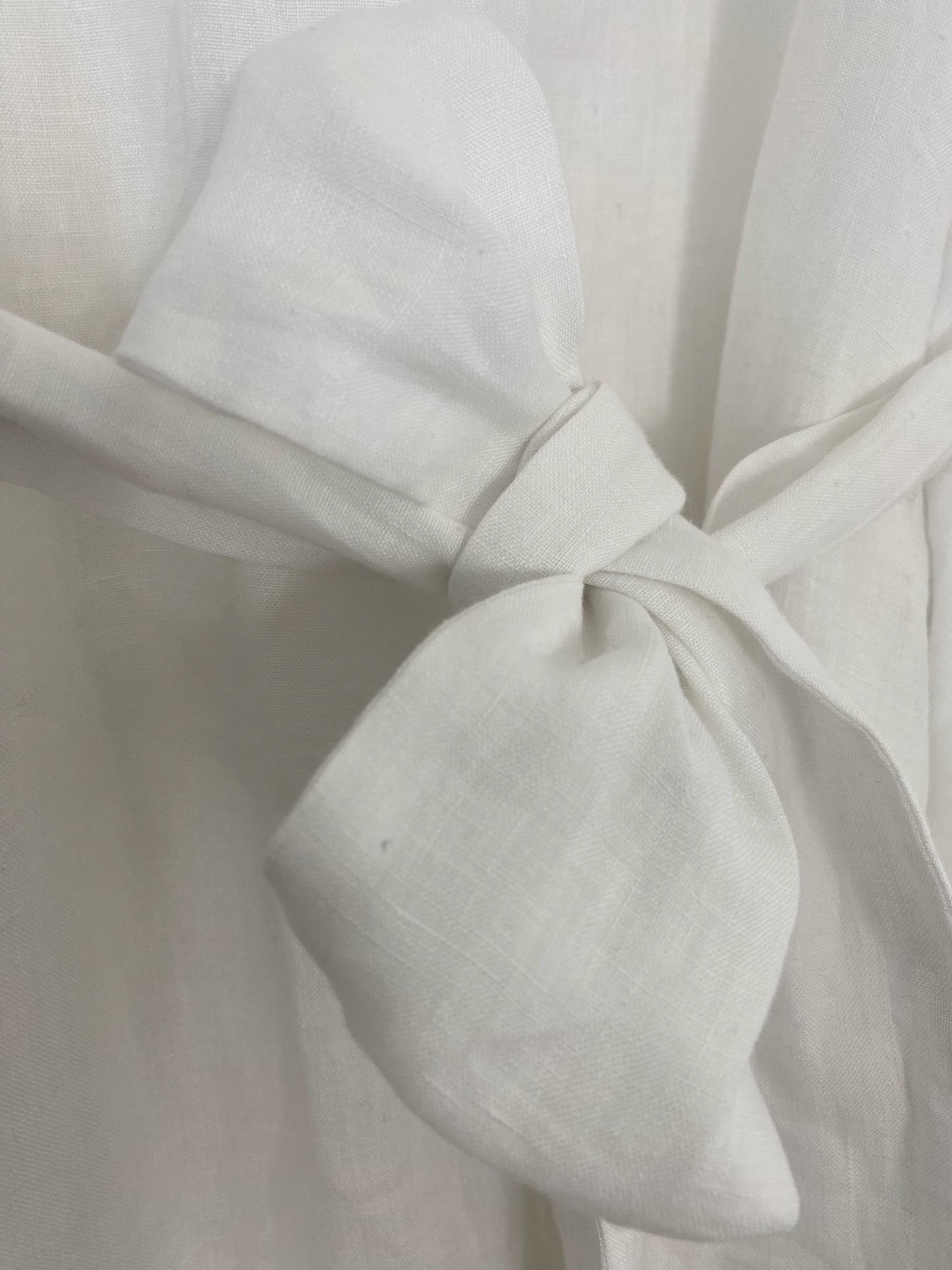 White linen kaftan by MACOEY with midi silhouette, side pockets and detachable belt