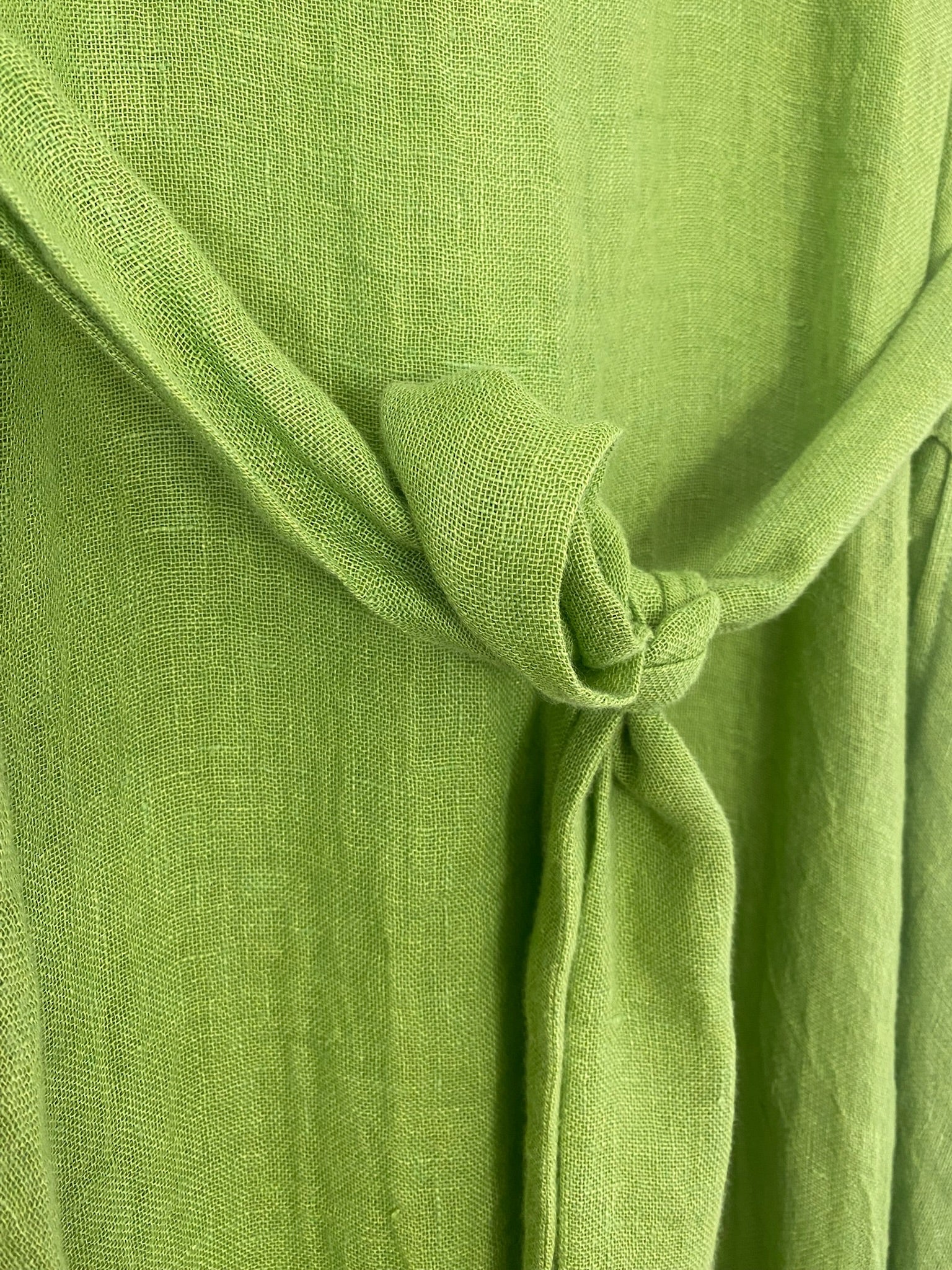 Green linen kaftan by MACOEY with midi silhouette, side pockets and detachable belt